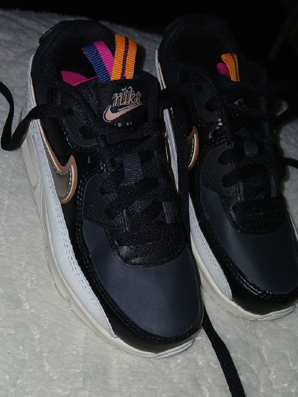 Nike Kids Black Sneakers with Metallic Gold Swoosh & Pink and Orange Pull Tabs